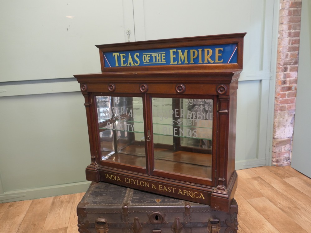 Victorian mahogany shop display cabinet featuring gilded signage reading Teas of the Empire and acid-etched glass doors. View III