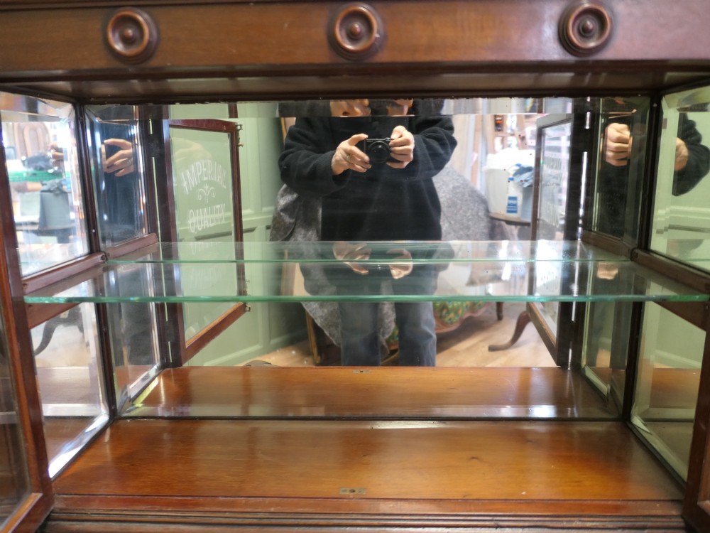 Victorian mahogany shop display cabinet featuring gilded signage reading Teas of the Empire and acid-etched glass doors. View V