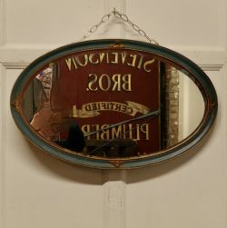 OVAL GILT AND PAINTED WALL MIRROR