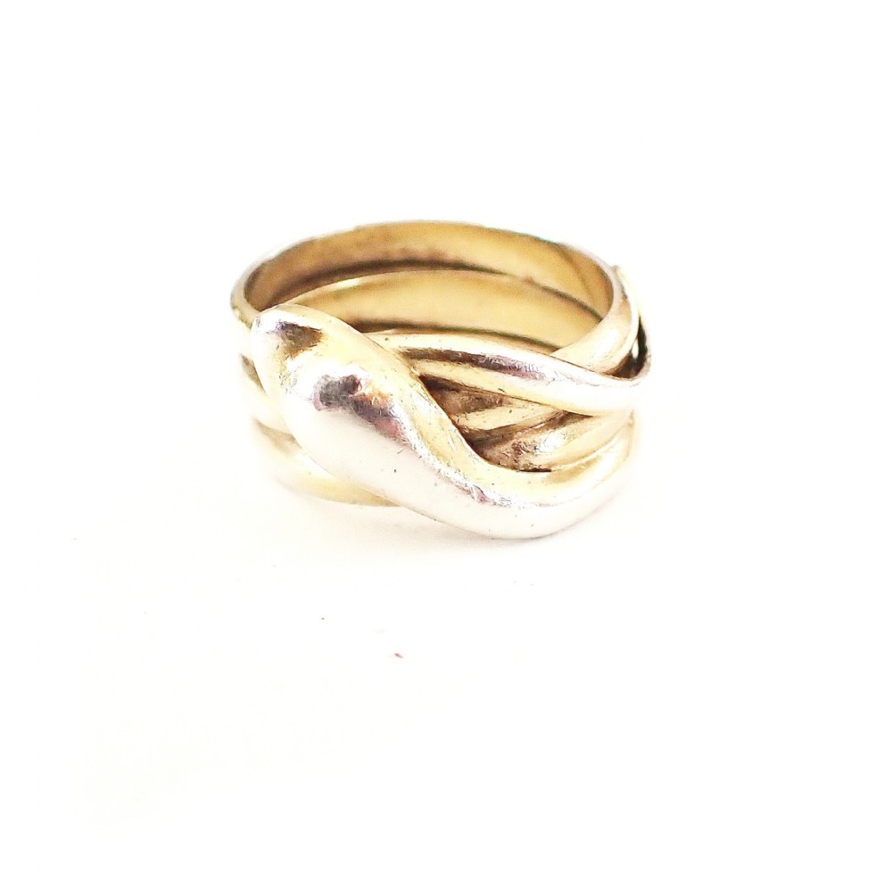 An Art Deco silver ring designed as a coiled serpent wrapped tightly around the finger.