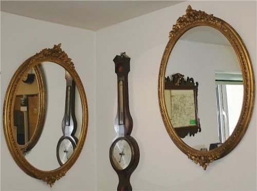 A Pair of Late 19c Gilt Oval Wall Mirrors Having Vine & Grape Decorated Surmounts.