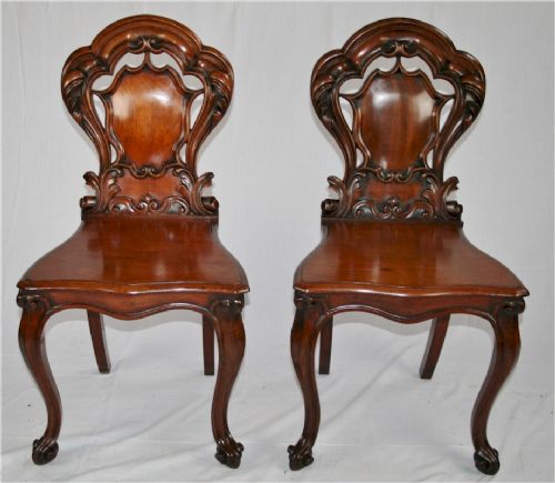 Victorian Mahogany Pair of Hall Chairs with Carved Backs on Cabriole Legs.    
