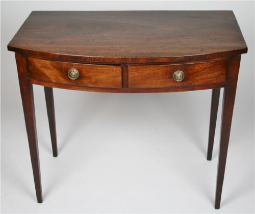 George 111 Mahogany Bow Front Side Table Having 2 Oak Lined Drawers with Brass Ring Handles.