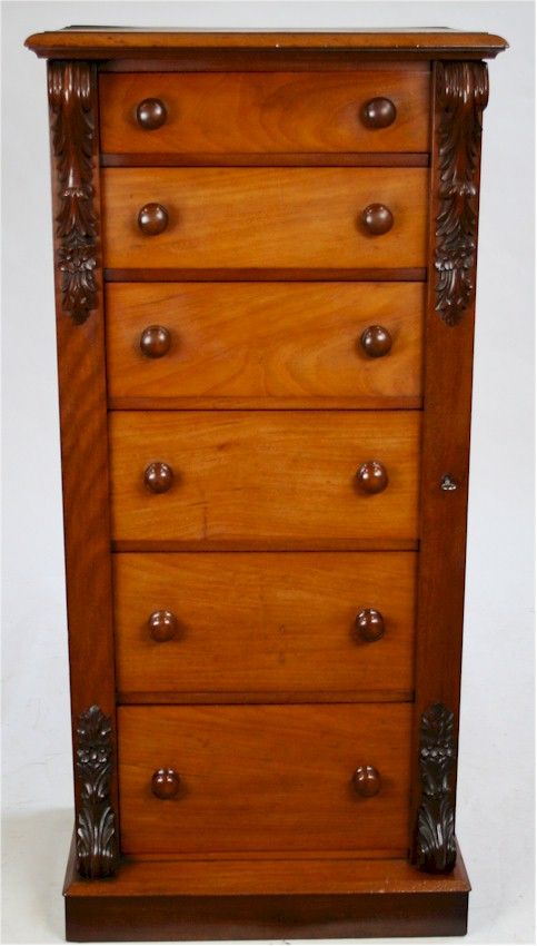 Victorian Mahogany 6 Drawer Wellington Chest with Carved Corbels on Plinth Base.