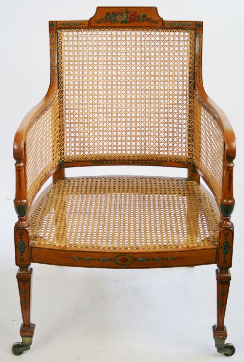Edwardian Satinwood Bergere Armchair Having Painted Decoration.