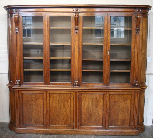 Victorian Figured Walnut Bow End 12 Door Bookcase.