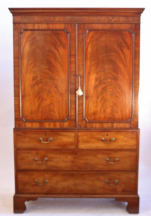 A Fine George 111 Figured Mahogany Linen Press with Sliding Trays