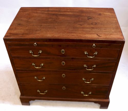 GEORGE 111 FIGURED MAHOGANY SLIDE CHEST OF 4 LONG DRAWERS - ADDITIONAL PHOTO 1