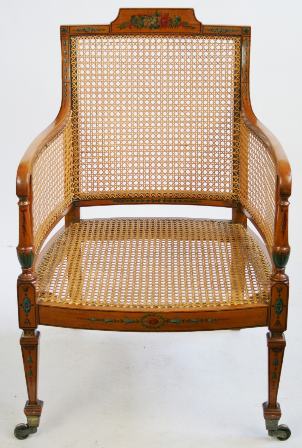 Edwardian Satinwood Bergere Armchair having Painted Decoration.