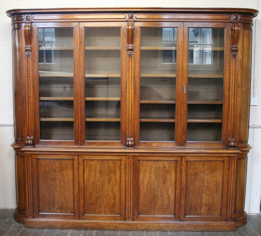 Victorian Figured Walnut Bow End 12 Door Bookcase.