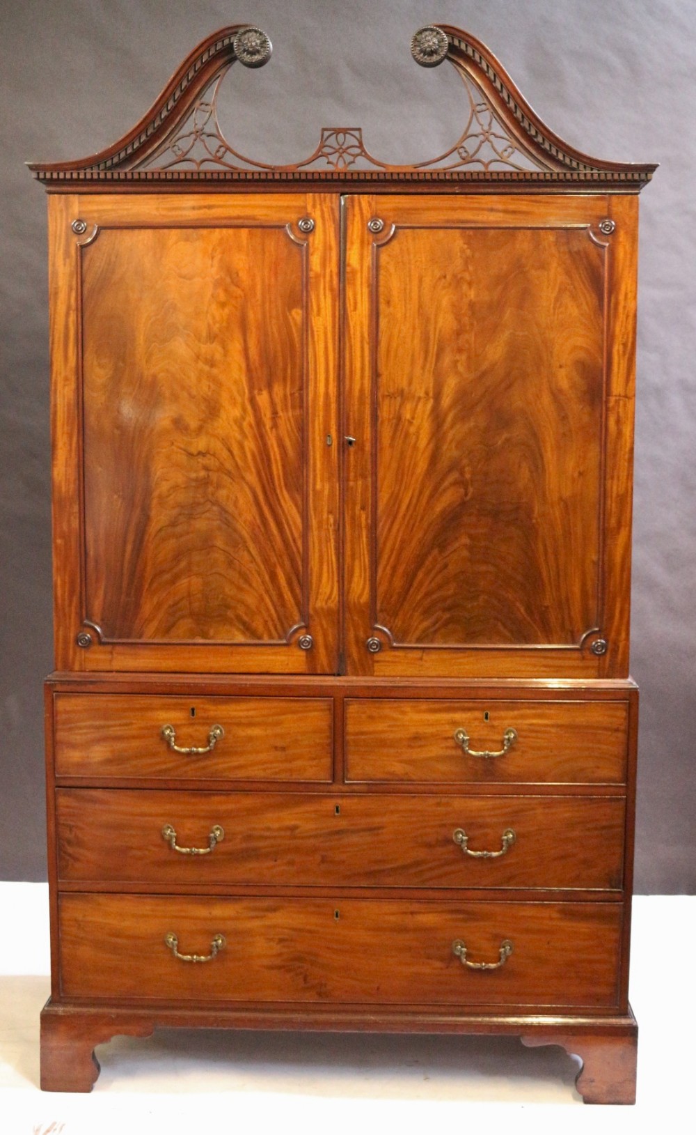 Fine George 111 'Chippendale Style' Linen Press with Swanneck Cornice