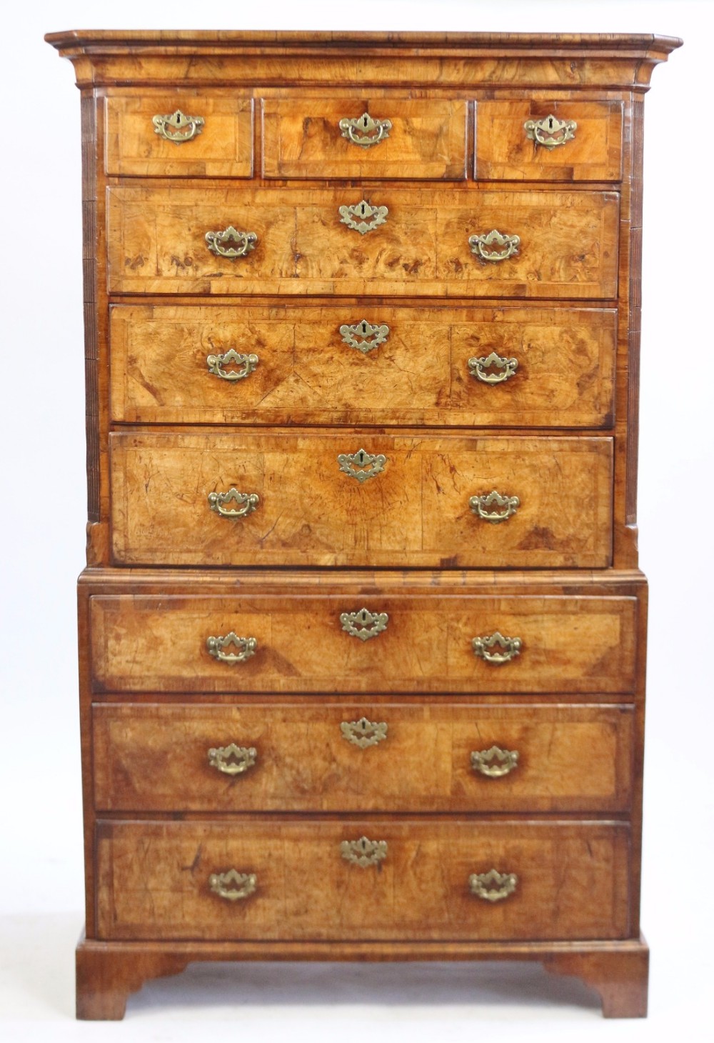 A George II Good Coloured Figured Walnut Featherbanded Chest-on-Chest