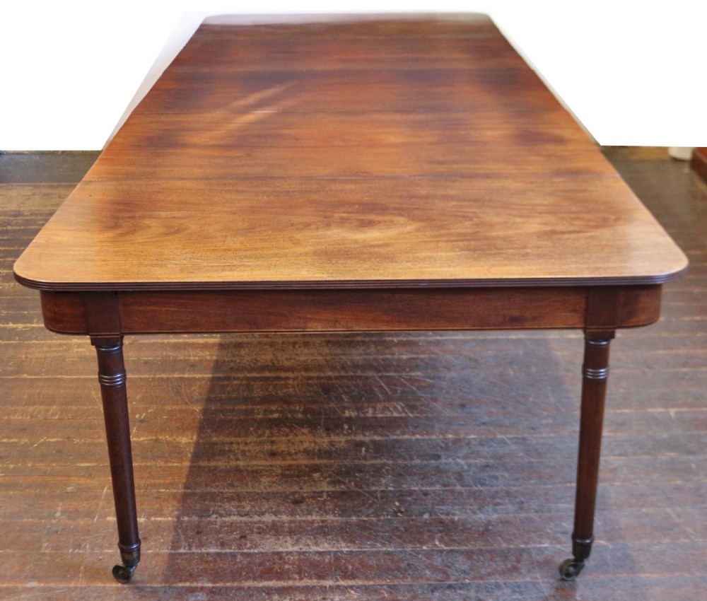 George 111 Mahogany 'Imperial' Action Extending Dining Table with 3 Extra Leaves. 