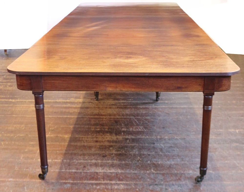 George 111 Mahogany 'Imperial' Action Extending Dining Table with 3 Extra Leaves.  View II