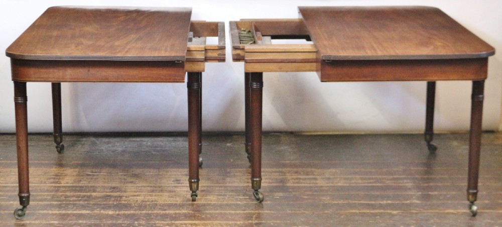 George 111 Mahogany 'Imperial' Action Extending Dining Table with 3 Extra Leaves.  View VI