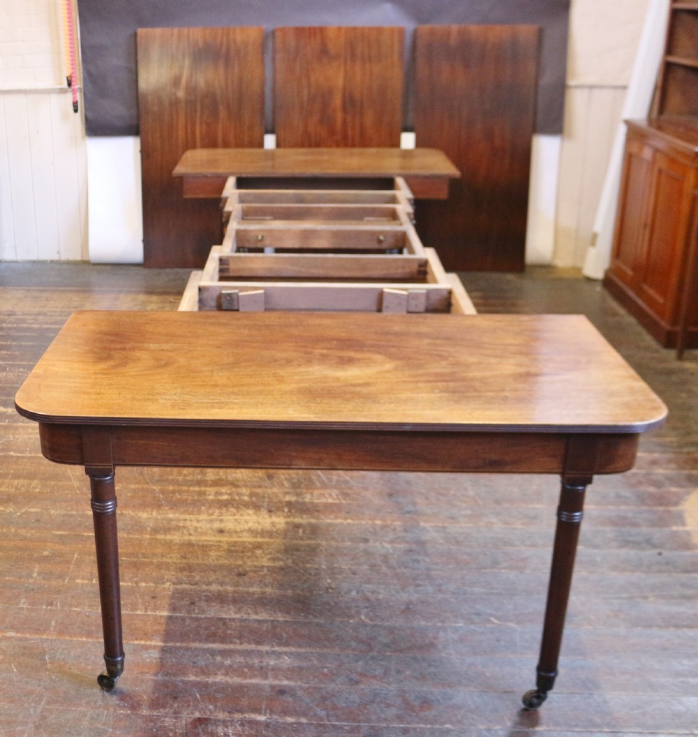 George 111 Mahogany 'Imperial' Action Extending Dining Table with 3 Extra Leaves.  View VIII