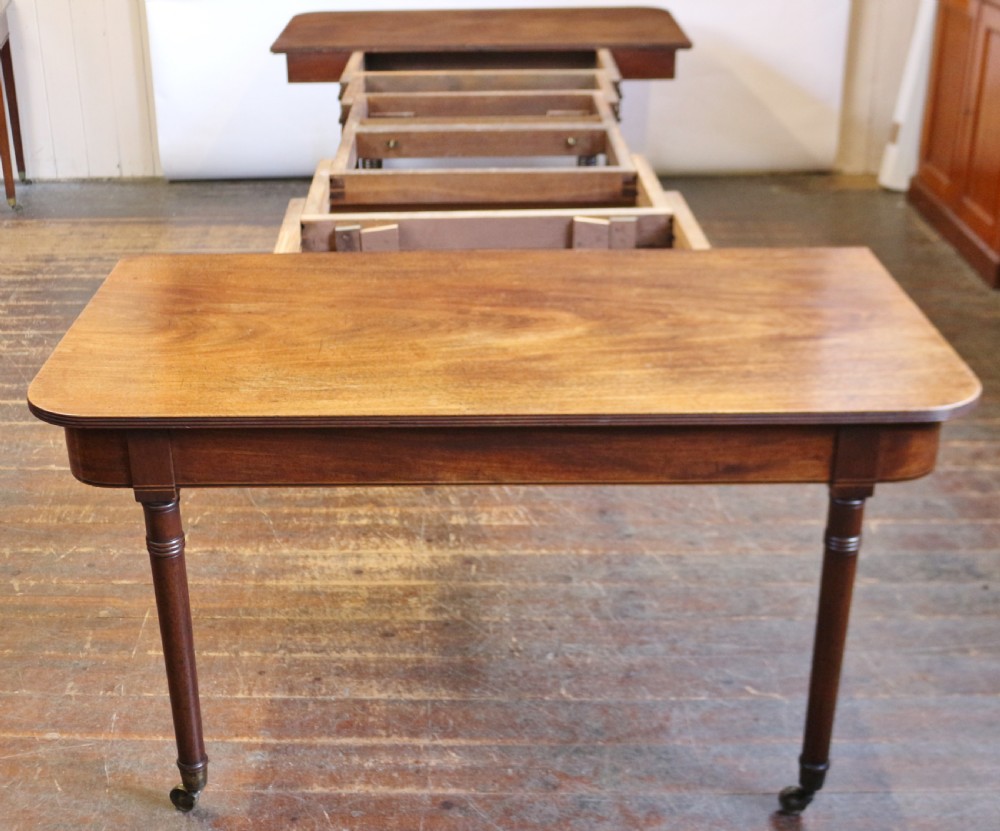George 111 Mahogany 'Imperial' Action Extending Dining Table with 3 Extra Leaves.  View X