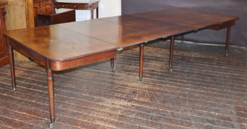 George 111 Mahogany 'Imperial' Action Extending Dining Table with 3 Extra Leaves.  View XI