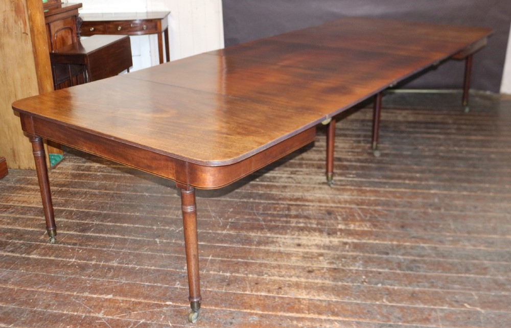George 111 Mahogany 'Imperial' Action Extending Dining Table with 3 Extra Leaves.  View XII