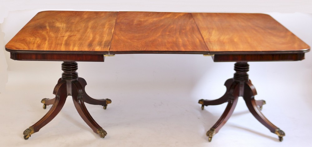 A Fine Regency Mahogany 2 Pillar Dining Table with Extra Leaf