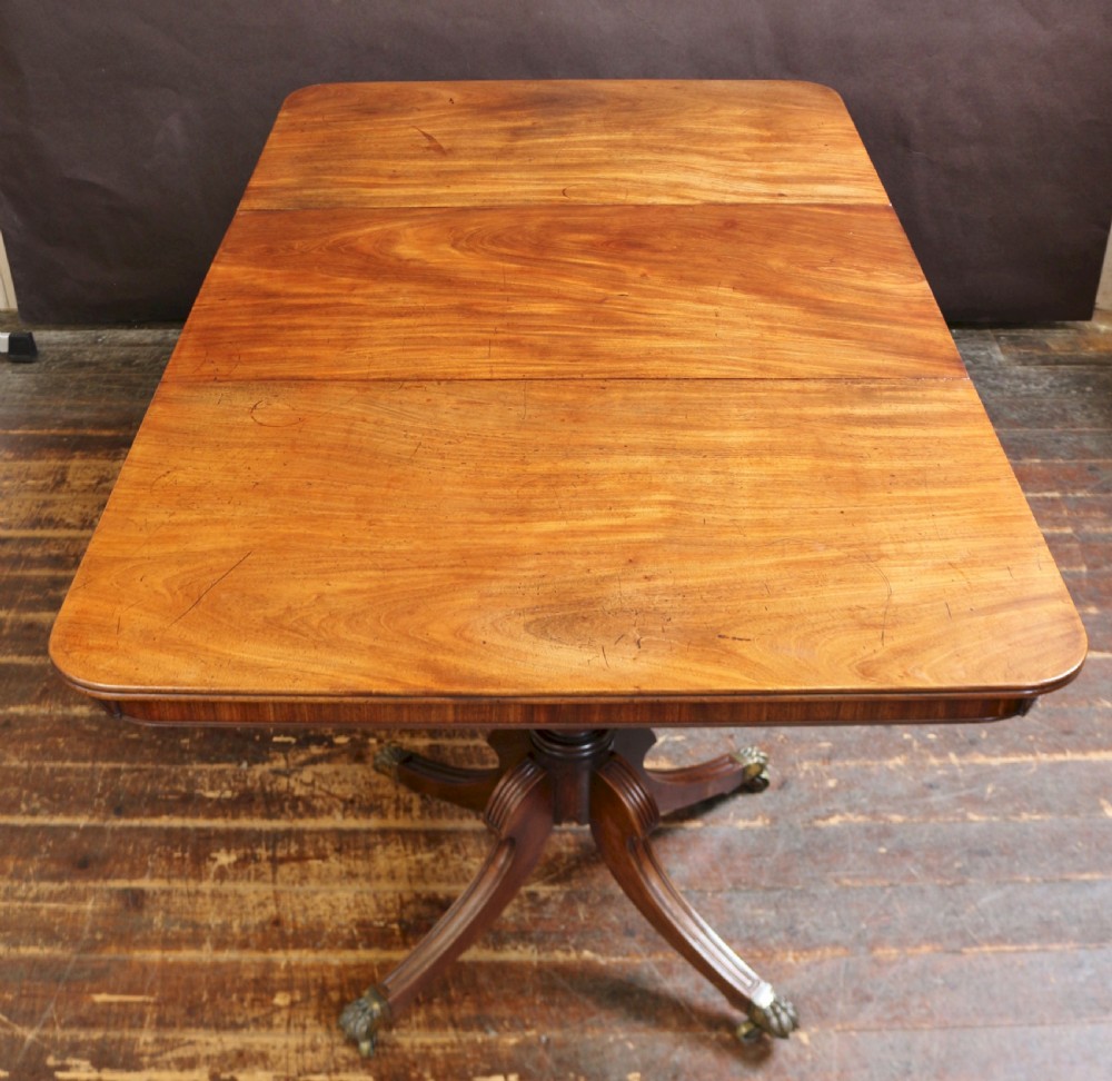 A Fine Regency Mahogany 2 Pillar Dining Table with Extra Leaf View III