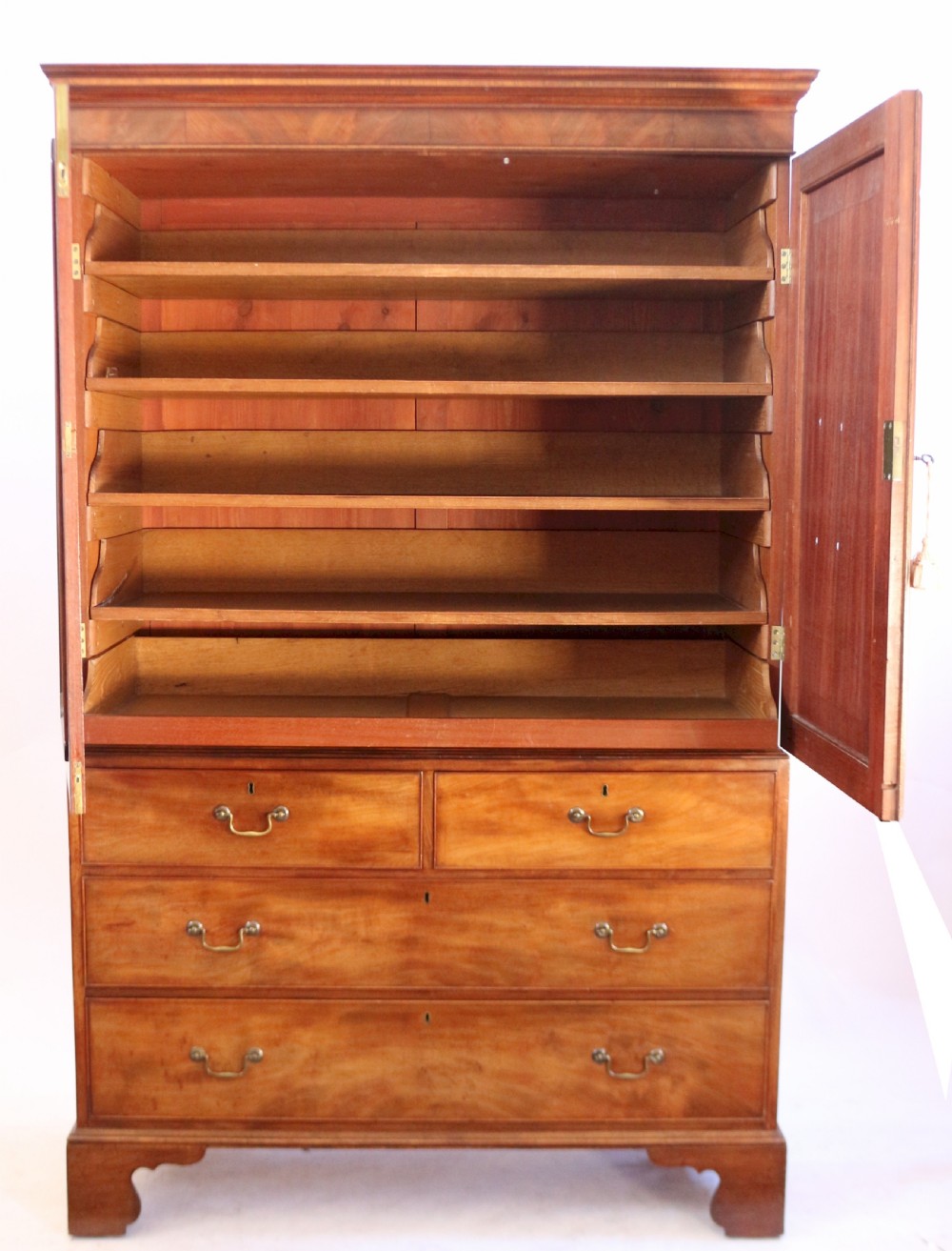 A Fine George 111 Figured Mahogany Linen Press with Sliding Trays View II