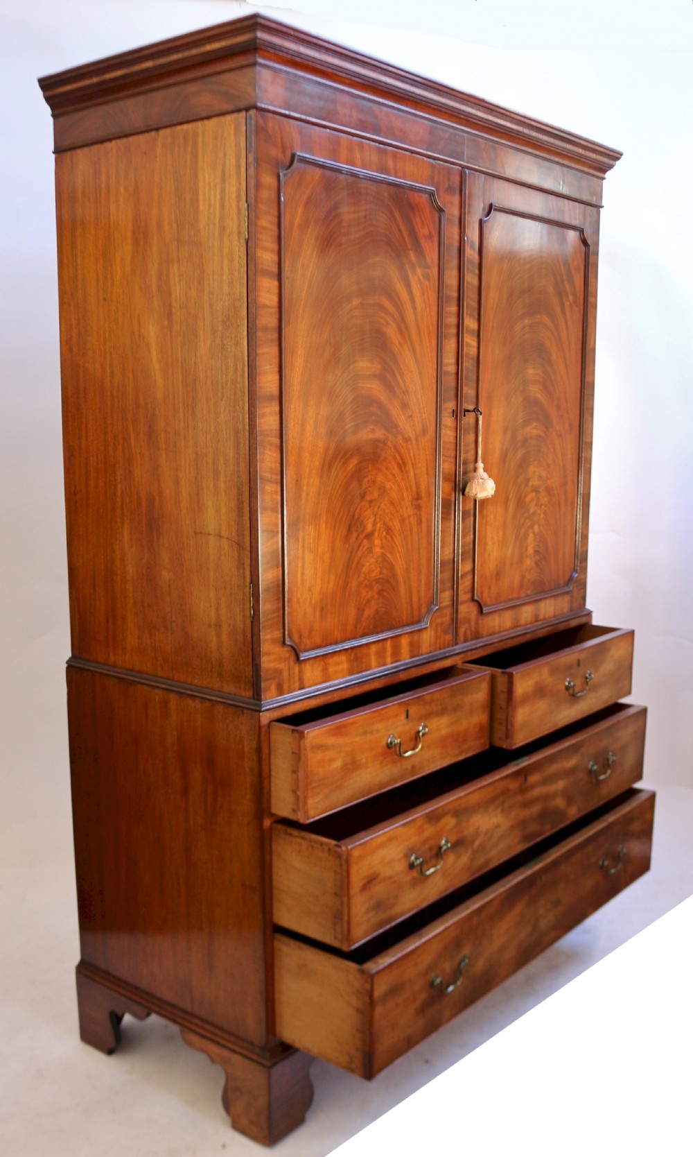 A Fine George 111 Figured Mahogany Linen Press with Sliding Trays View III