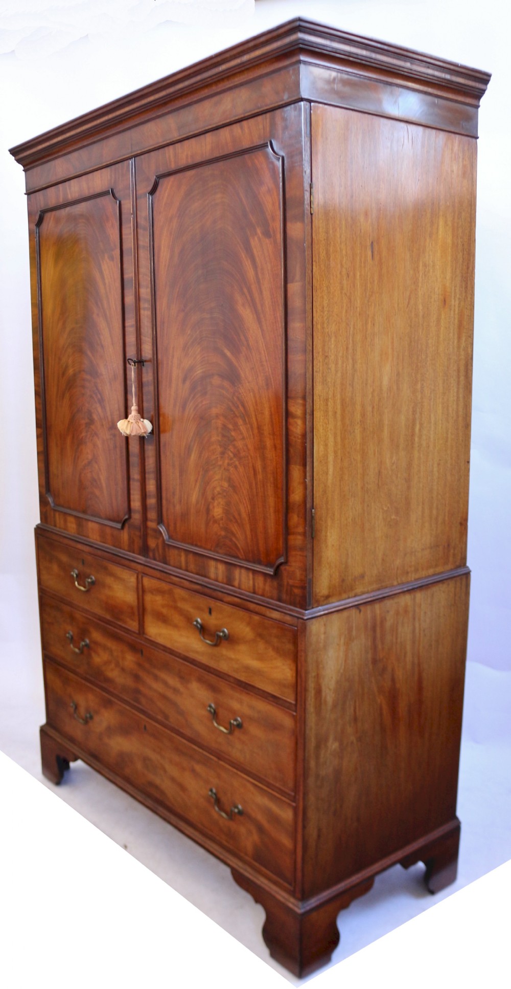 A Fine George 111 Figured Mahogany Linen Press with Sliding Trays View IV