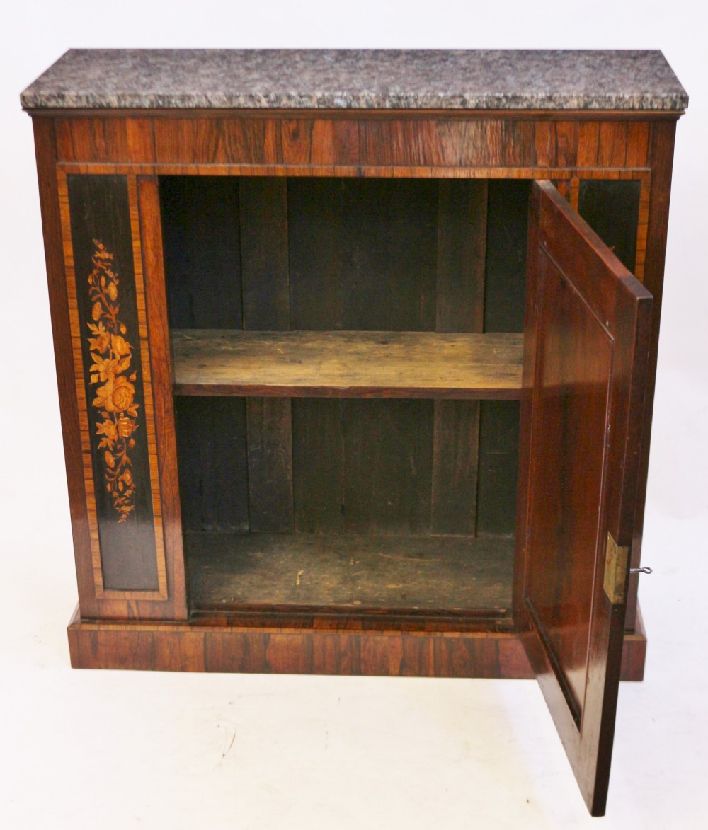A Victorian rosewood side cupboard featuring an inlaid floral marquetry central door, flanking inlaid side panels, and a grey marble top. View II