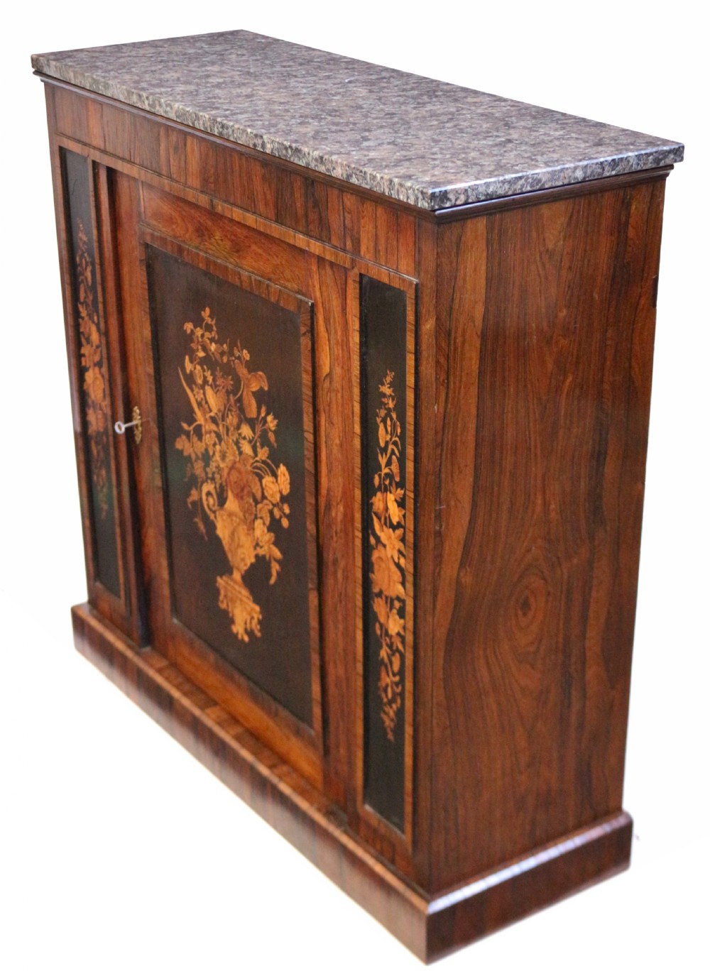A Victorian rosewood side cupboard featuring an inlaid floral marquetry central door, flanking inlaid side panels, and a grey marble top. View VI