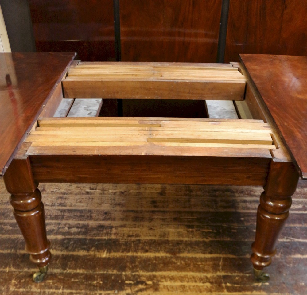 Early Victorian Mahogany Extending Dining Table having 3 Extra Leaves View IV