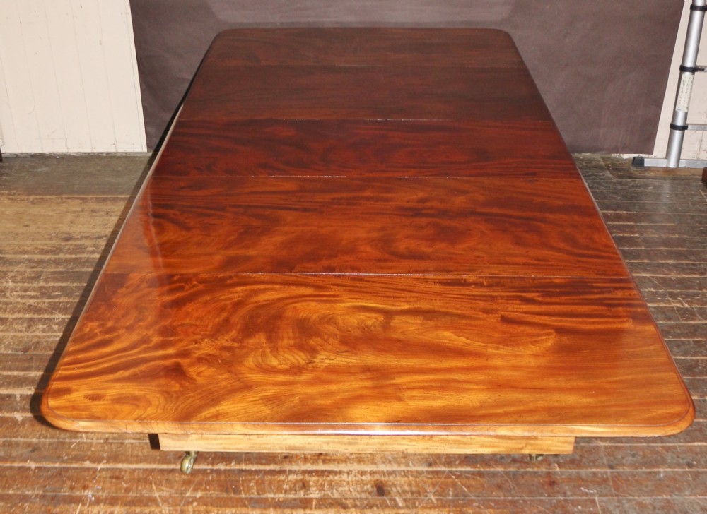Early Victorian Mahogany Extending Dining Table having 3 Extra Leaves View IX