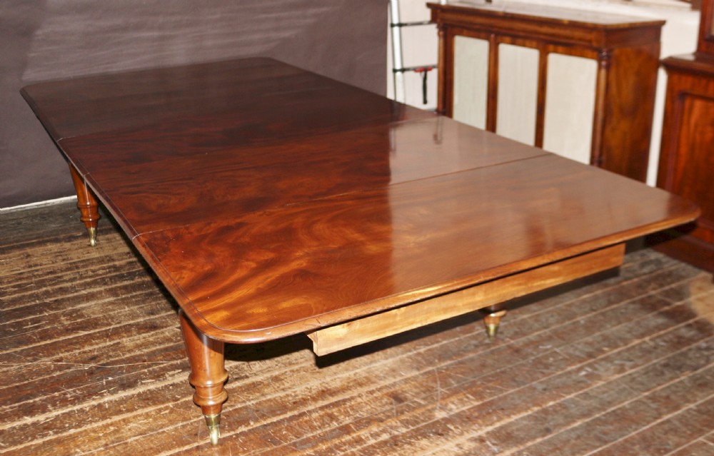 Early Victorian Mahogany Extending Dining Table having 3 Extra Leaves View X
