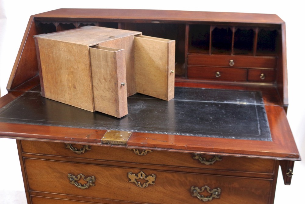 An 18th-century George III mahogany bureau with a slant-front writing slope, five graduated drawers, brass swan-neck handles, and bracket feet. View VII
