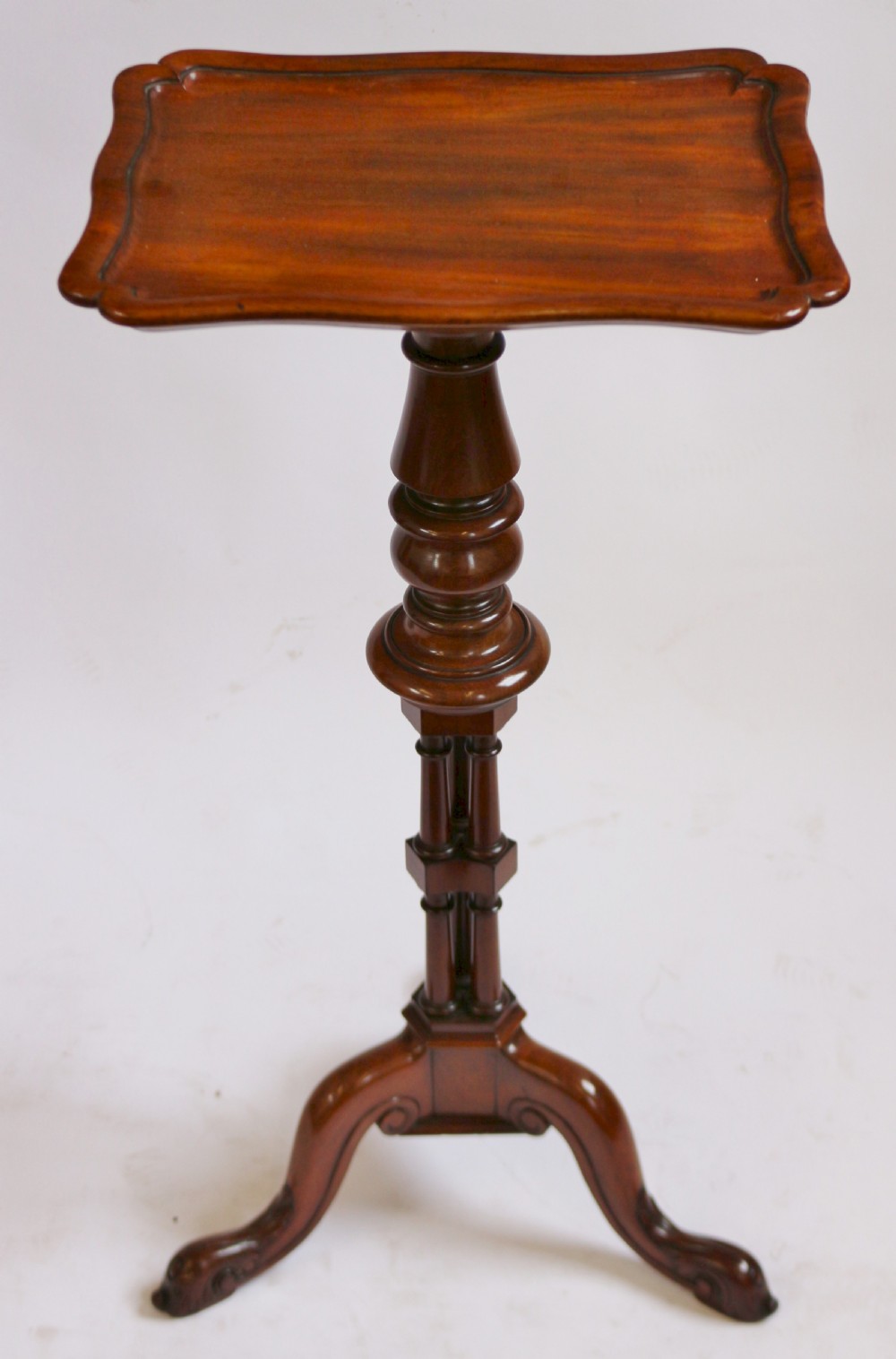 A Regency period thuyawood tripod table featuring a scalloped tray top, turned pedestal stem with clustered columns, and three scrolled feet. View III