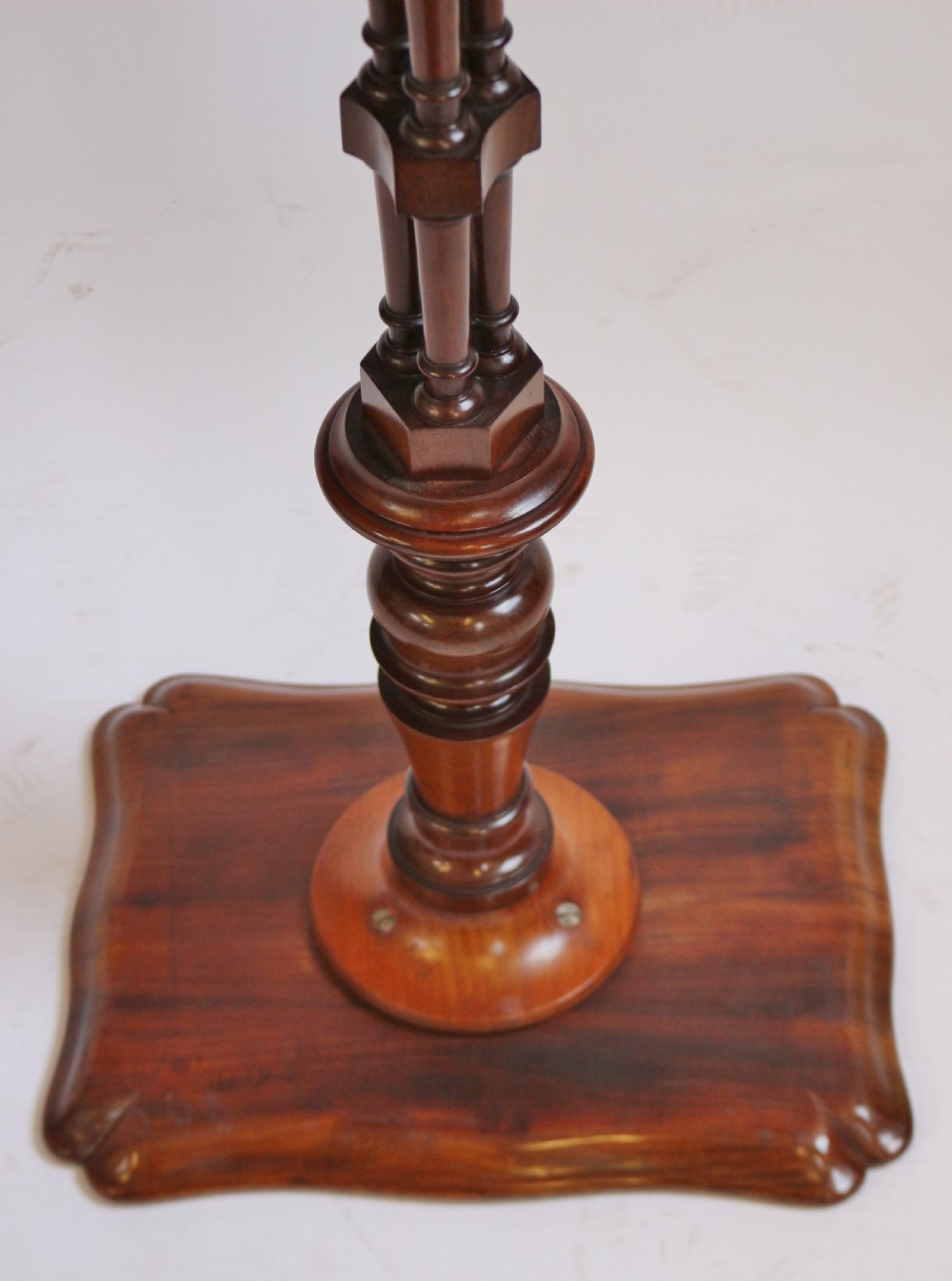 A Regency period thuyawood tripod table featuring a scalloped tray top, turned pedestal stem with clustered columns, and three scrolled feet. View IX