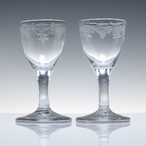 PAIR 18TH CENTURY ENGRAVED WHISKY DRAM GLASSES C1740 WITH FOLDED FEET - ADDITIONAL PHOTO 1