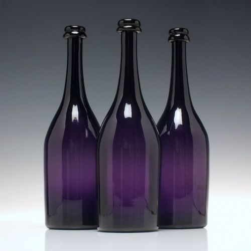 Three Victorian Amethyst Glass Wine Serving Bottles C1860