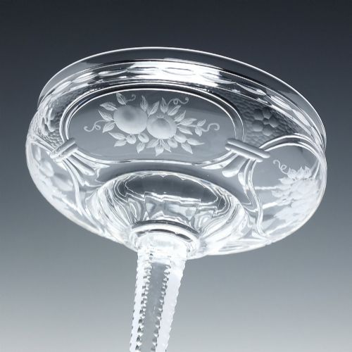 fig 4. A set of six French Art Nouveau clear lead crystal champagne coupes with tall beaded stems and etched floral motifs on shallow bowls.
