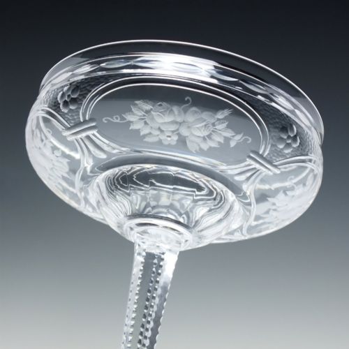 fig 6. A set of six French Art Nouveau clear lead crystal champagne coupes with tall beaded stems and etched floral motifs on shallow bowls.