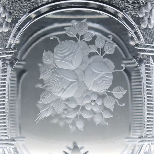 fig 5. A set of six clear lead crystal wine glasses featuring intricate acid-etched floral panels and textured facet-cut stems.