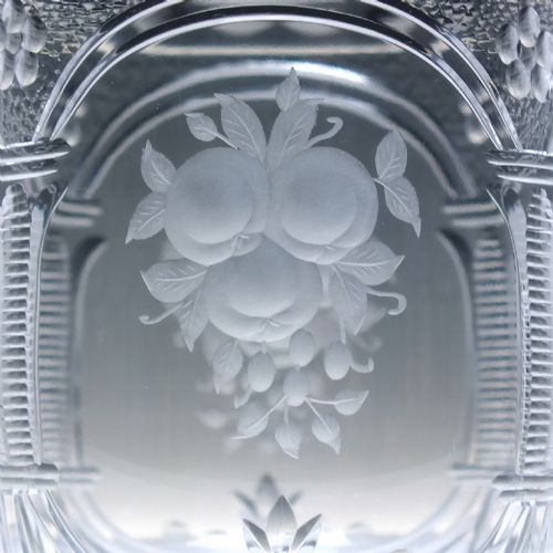 fig 6. A set of six clear lead crystal wine glasses featuring intricate acid-etched floral panels and textured facet-cut stems.