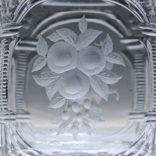 fig 7. A set of six clear lead crystal dram glasses featuring acid-etched floral panels set within archways and faceted diamond-cut stems.