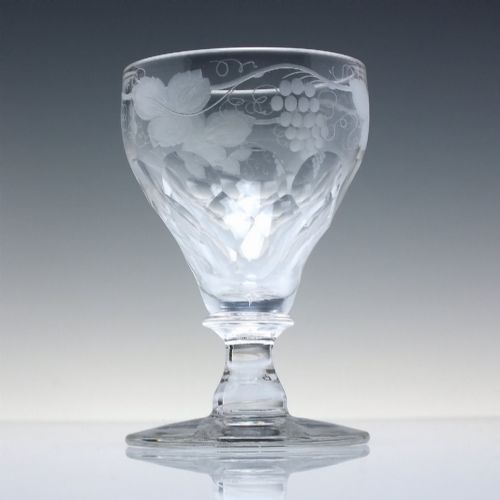 fig 3. A set of six vintage clear glass port goblets featuring wheel-engraved grapevine motifs on pan-topped bowls with cut facet details.