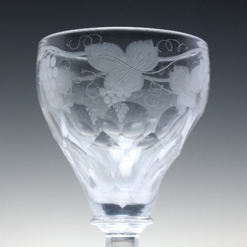 fig 4. A set of six vintage clear glass port goblets featuring wheel-engraved grapevine motifs on pan-topped bowls with cut facet details.