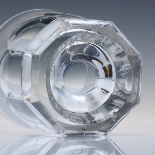 fig 2. A clear mid-19th-century Victorian glass whisky tumbler featuring fluted panels around the lower body and a thick base.