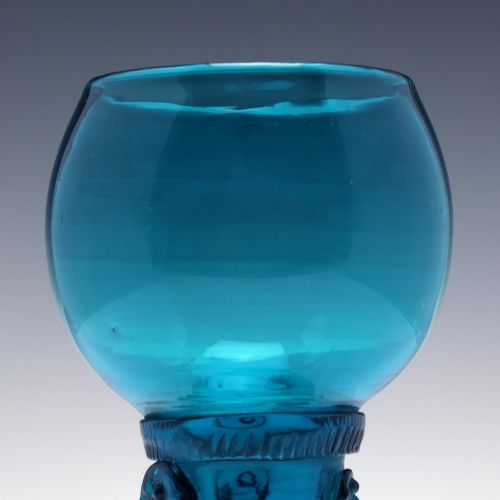 fig 3. A pair of early 19th-century peacock blue glass roemers with globular bowls, prunted stems, and broad coiled pedestals.