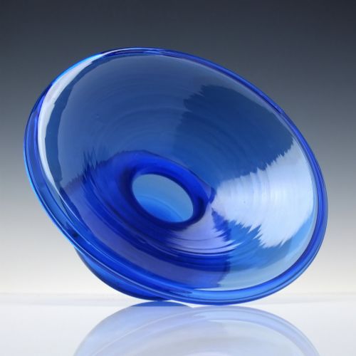 fig 1. A 19th-century cobalt blue glass spittoon with a wide flared rim and a rounded bulbous base.