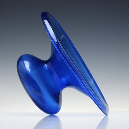 fig 3. A 19th-century cobalt blue glass spittoon with a wide flared rim and a rounded bulbous base.