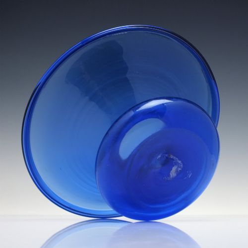 fig 4. A 19th-century cobalt blue glass spittoon with a wide flared rim and a rounded bulbous base.
